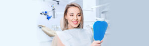 Patient smiling after receiving dental bridges at Center for Oral Health